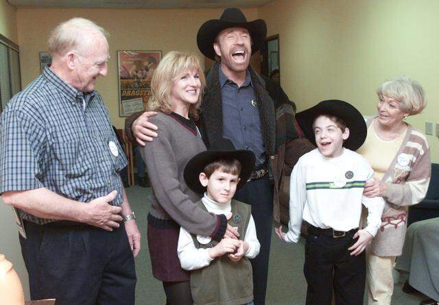 Feb. 27, 2001: Nicholas Bartoe, second from right, got the opportunity to visit the set of “Walker, Texas Ranger,” during the filming of the 200th episode, through the Make a Wish Foundation. In the photo are, from left, his grandfather Jim Bartoe, Melanie Oberhelman of Olathe, Kansas, with her 6-year-old son Markus Perry, actor Chuck Norris, 11-year-old Nicholas of Buckeye Lake, Ohio, and grandmother Sharon Bartoe.